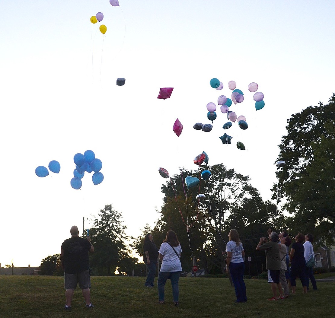 <p class="Picture">Six Port Chester and Rye Brook families remembered their deceased children by releasing a bundle of balloons with messages like &ldquo;My Angel Boy,&rdquo; &ldquo;We miss you,&rdquo; and &ldquo;We love you&rdquo; written on them on Thursday, Sept. 22 next to Park Avenue School. This is the second year the parents have come together to honor their children in this manner. This tribute is done in conjunction with the Grieving Parents Worldwide Balloon Release, where parents from all over the world release balloons for their deceased children.&nbsp;</p> <p class="Byline">Photo Story by Casey Watts</p>