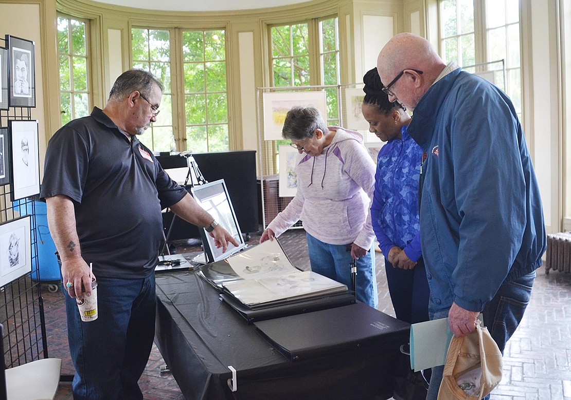<p class="Picture">Self-taught artist Steven Rossi of Yonkers shows off his black-and-white drawings of athletes to Brookridge Court resident Connie Lipman, Marlene Lesperance of Stamford, Conn., and Elliot Grosswirth of Dobbs Ferry.&nbsp;</p>