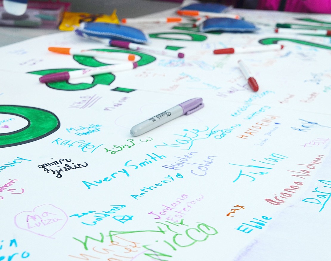 <p class="Picture">After around 200 students signed their names, the four-piece poster was covered in colorful signatures, hearts and drawings.&nbsp;</p>