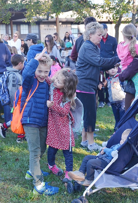 <p class="Picture">A brother and sister make funny faces while saying goodbye to their youngest brother and mother.&nbsp;</p>