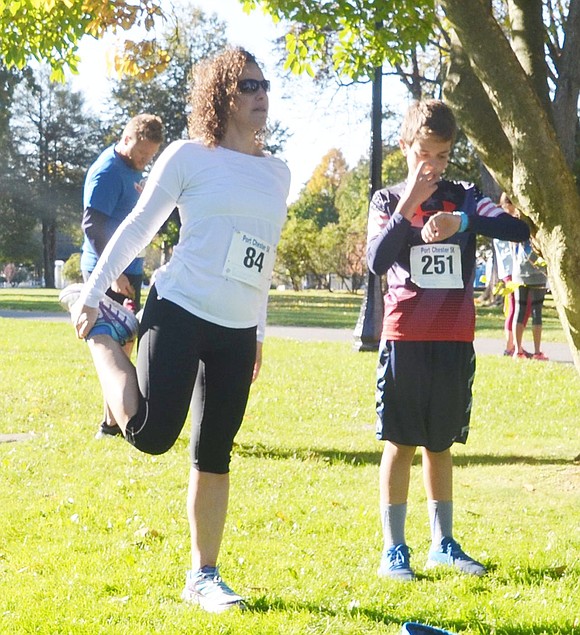 <p class="Picture">Excited for their first run together, Valley Terrace mother and son combo Sandy Lithgow and 13-year-old Johnny Ramirez stretch before the race. Johnny placed first in his age group.</p>