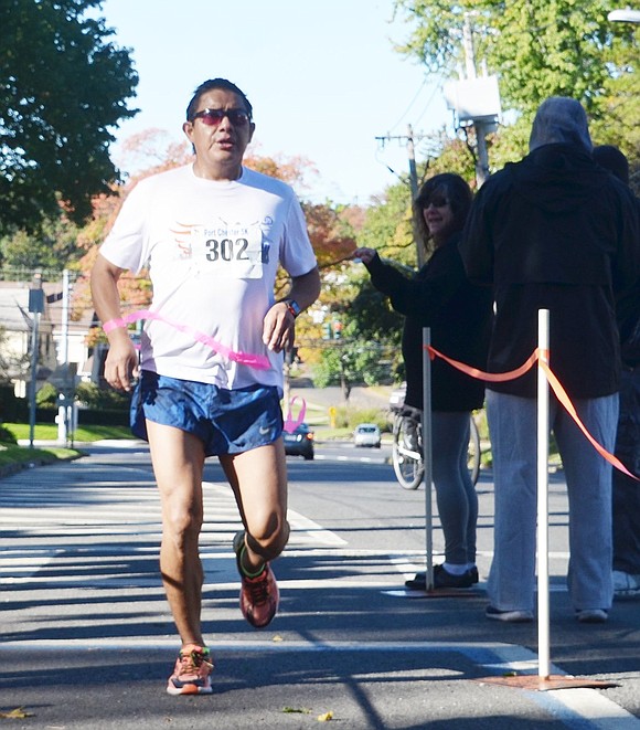 <p class="Picture">First place male runner Pedro Yupa of Irving Avenue finished with an impressive time of 17 minutes and 45 seconds.&nbsp;</p>