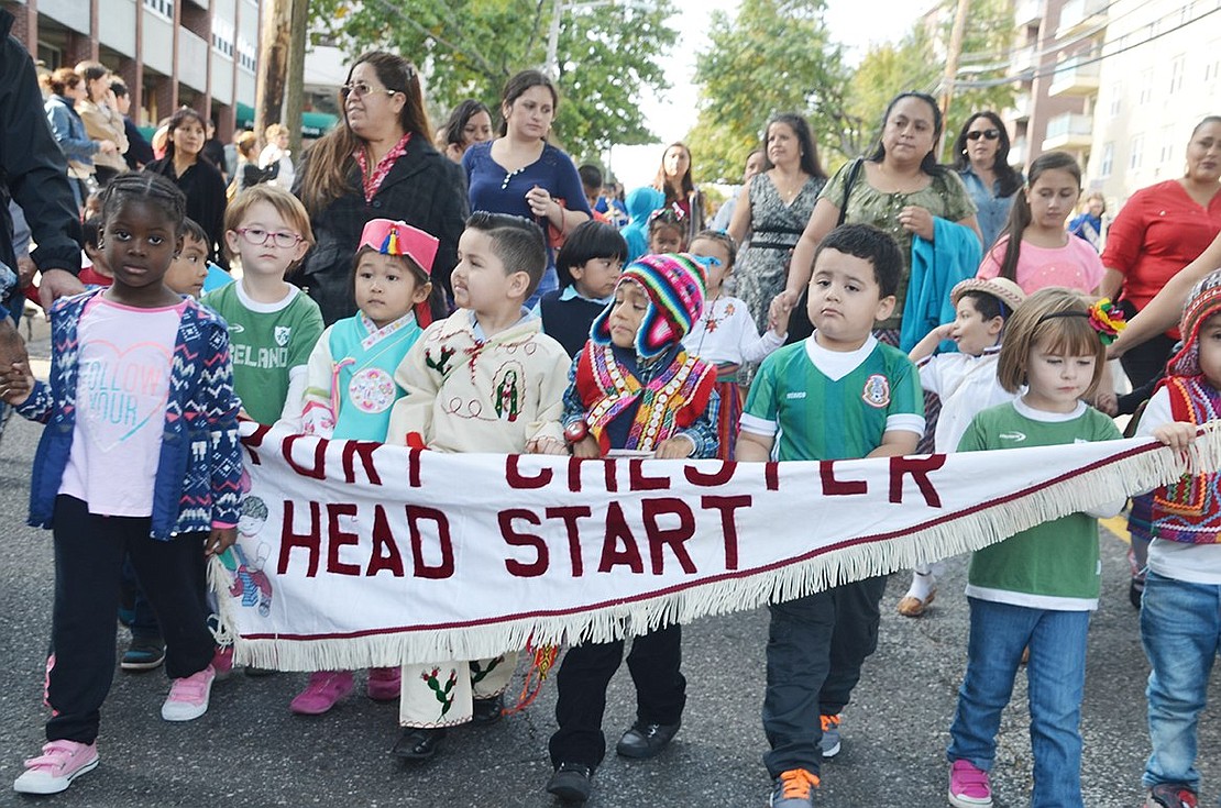 <p class="Picture">The diverse group that makes up the students in the Port Chester Head Start program trudge down Westchester.</p>