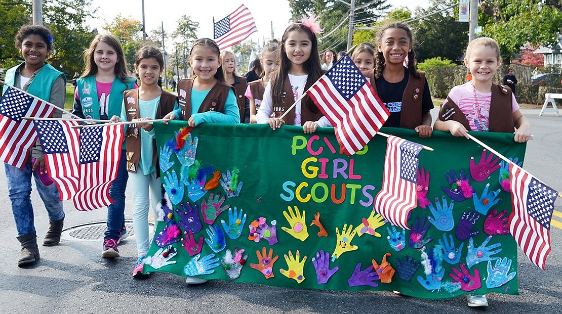 <p class="Picture">Members of various Port Chester and Rye Brook Girl Scout and Brownie troops march as one.</p>