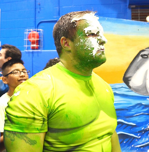 <p class="Picture">Frank Carlson tries to contain his Hulk rage after one of his students threw a pie in his face.</p>