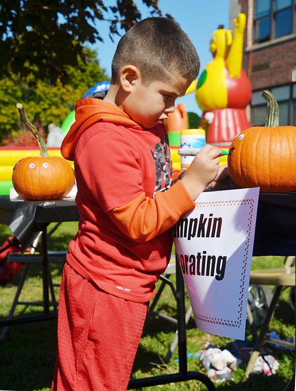 <p class="Picture">Maximiliano Sanchez, 6, of Park Avenue begins to decorate a spooky pumpkin for Halloween. It wasn&rsquo;t long before he finished the face and started scattering ghost stickers all over his creation during Park Avenue School&rsquo;s Fall Fling on Saturday, Oct. 15.&nbsp;</p> <p class="Byline">Photo Story By Casey Watts</p>