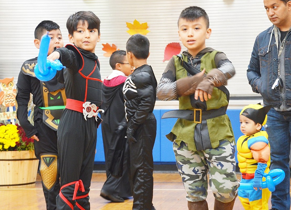 <p class="Picture">Second grade ninja Sergio Morales of Grandview Avenue points the way before engaging in an epic balloon sword fight with another boy.&nbsp;</p>