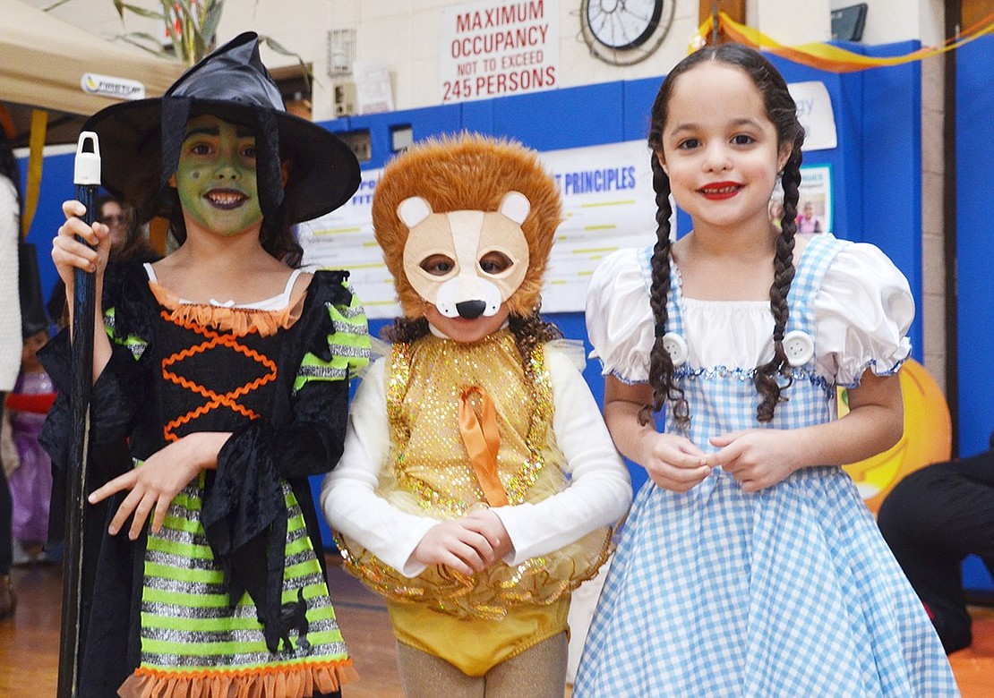 <p class="Picture">Wizard of Oz triplets Cynthia, Angelina and Daleila Romano, 6, stole the show when they walked into the gym to a chorus of oohs and ahhs during John F. Kennedy Magnet School&rsquo;s Early Learning Center Halloween Carnival on Saturday, Oct. 22. This event was for kindergarteners, first and second graders. The 3<sup>rd</sup>-5<sup>th</sup> grades had a Halloween dance the night before.&nbsp;</p> <p class="Byline">Photo story by Casey Watts</p>