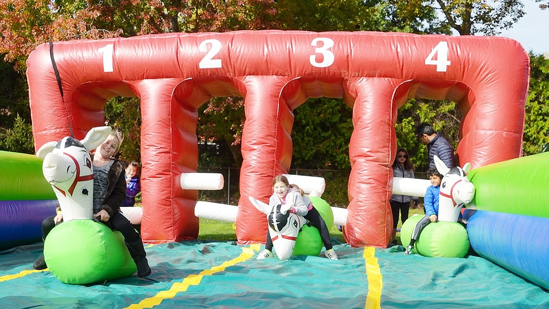 <p class="Picture">Three horse riders try to bounce their way to victory on the derby game. Some were experts, but most tumbled over the front of their steeds in a fit of giggles.&nbsp;</p>