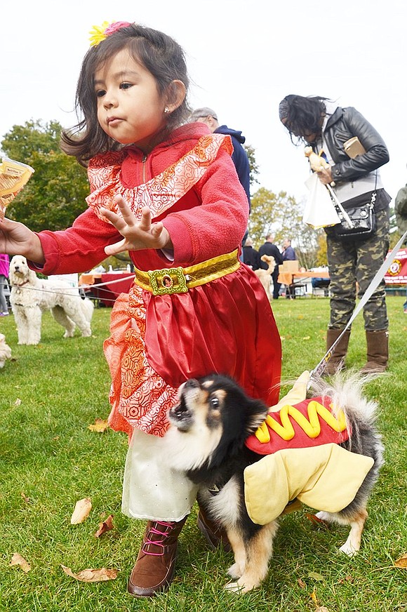 <p class="Picture">Dogs weren&rsquo;t the only ones who dressed up for Howl-o-ween. Princess Nicole Estrada of Maywood Avenue pranced around with her friend Zorro the hotdog.&nbsp;</p>