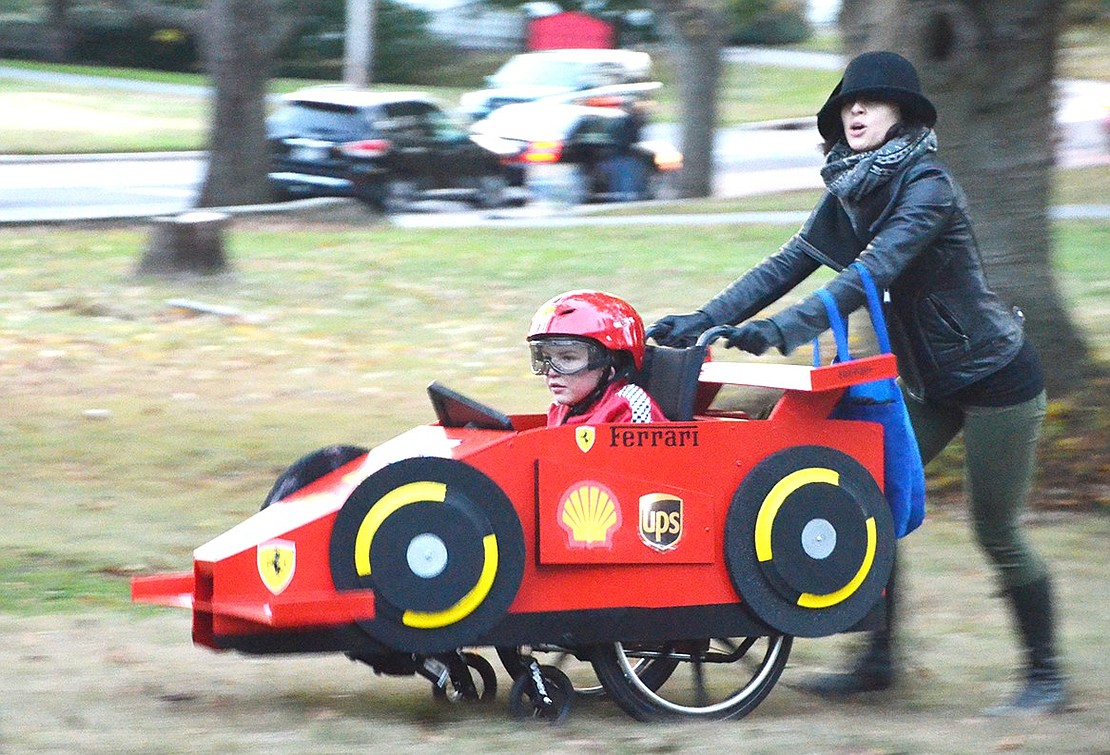 <p class="Picture">A speedster entered the race for the grand prize of sugary treats. Six-year-old Samuel is pushed around by his mother, Allyson Buck. The Glenville, Conn., residents won Most Original costume.&nbsp;</p>