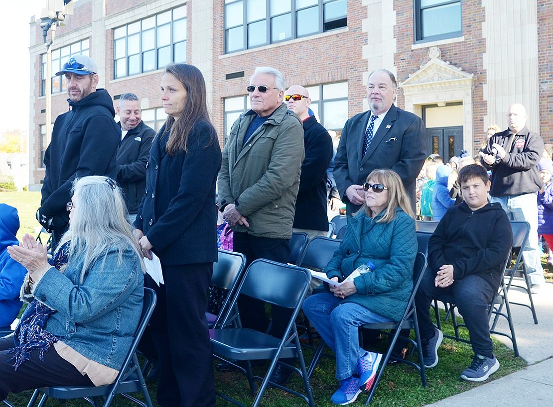 <p class="Picture">Port Chester veterans are asked to stand to be acknowledged. They later received little medals and trophies from their kids and family members.&nbsp;</p>