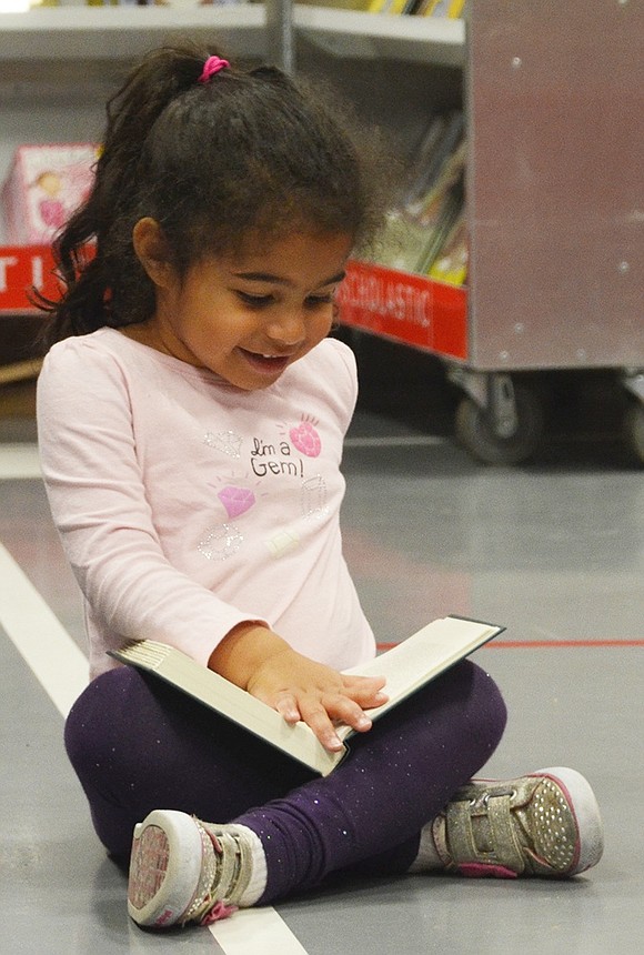 <p class="Picture">Before she can even read, future Ridge Street School student Amelia Sykes, 3, of Elm Hill Drive, is excited about books.&nbsp;</p>