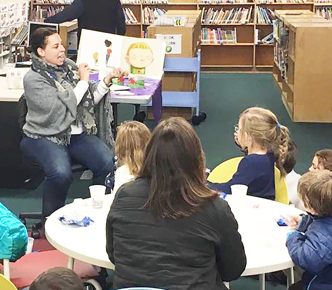 <p class="Picture">Principal Tracy Taylor reads to the kids in the library. </p> <p class="Right">Courtesy of Debra Cohen</p>