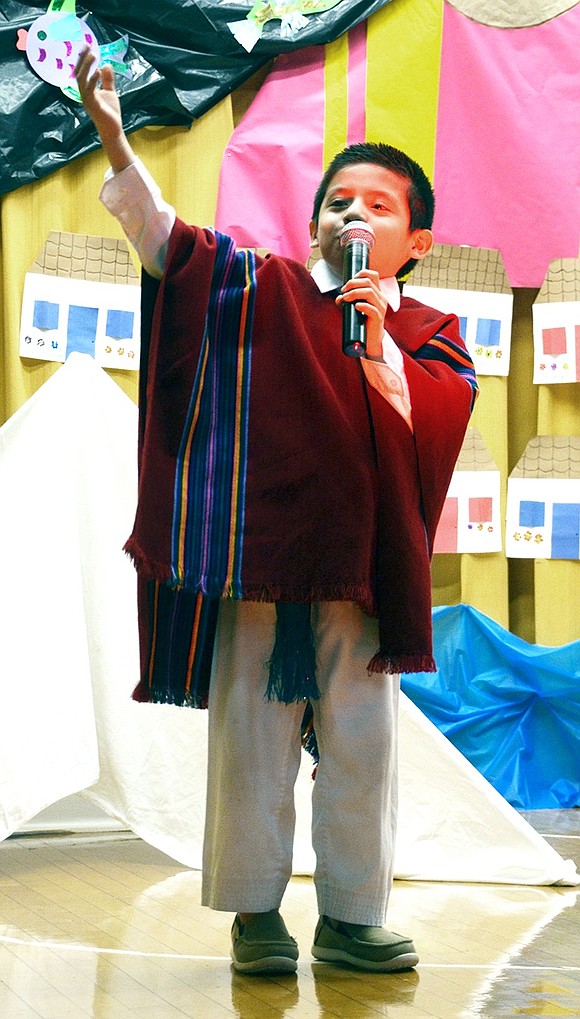 <p class="Picture">Third grader Joacob Gordillo solos the Ecuadorian song, &ldquo;Cantante Solista.&rdquo;&nbsp;</p>