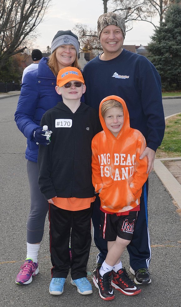 <p class="Picture">Lauren, Jeffrey, Wyatt, 9, and Trevor, 7, Feist of Rockinghorse Trail. Jeffrey is with Arctic Mechanical which was a sponsor of the run.</p>