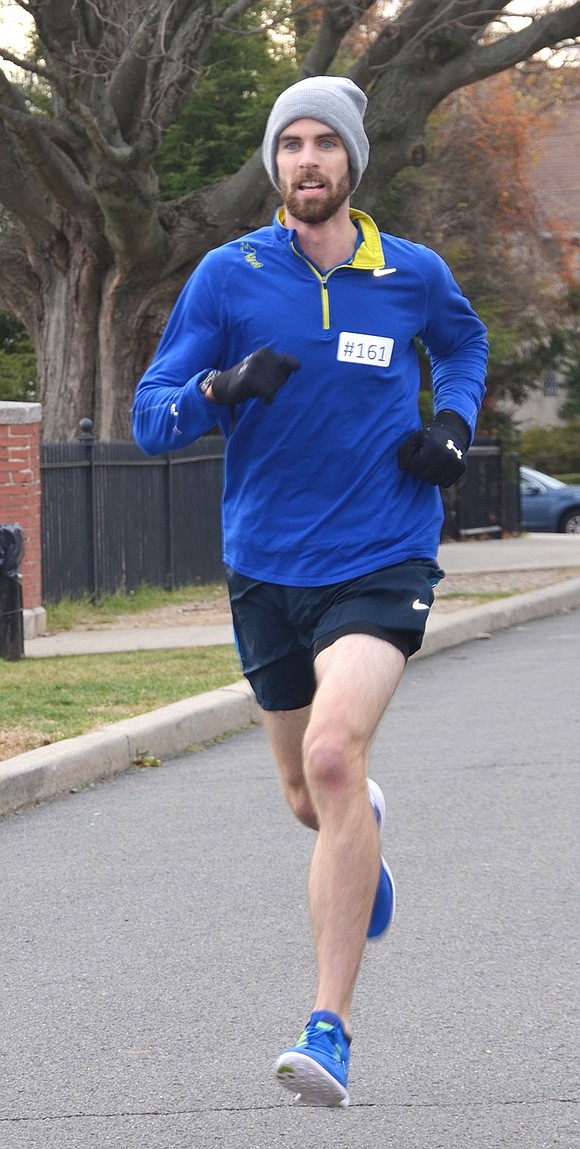 <p class="Picture">Declan Foley of White Plains was the first runner to complete the 3.5K race with a time of 16:50. It was his first time doing this race in many years.</p>