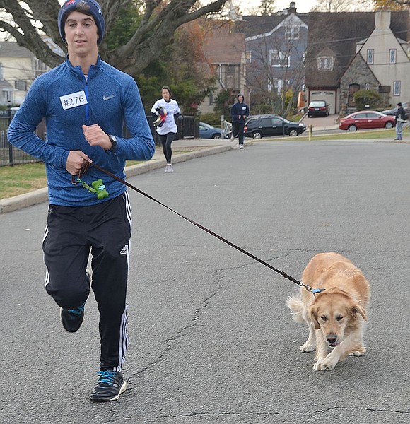 <p class="Picture">Sixteen-year-old Charlie Flanagan of Rye Brook, a junior at Iona Prep, runs with his golden retriever Maggie.</p>