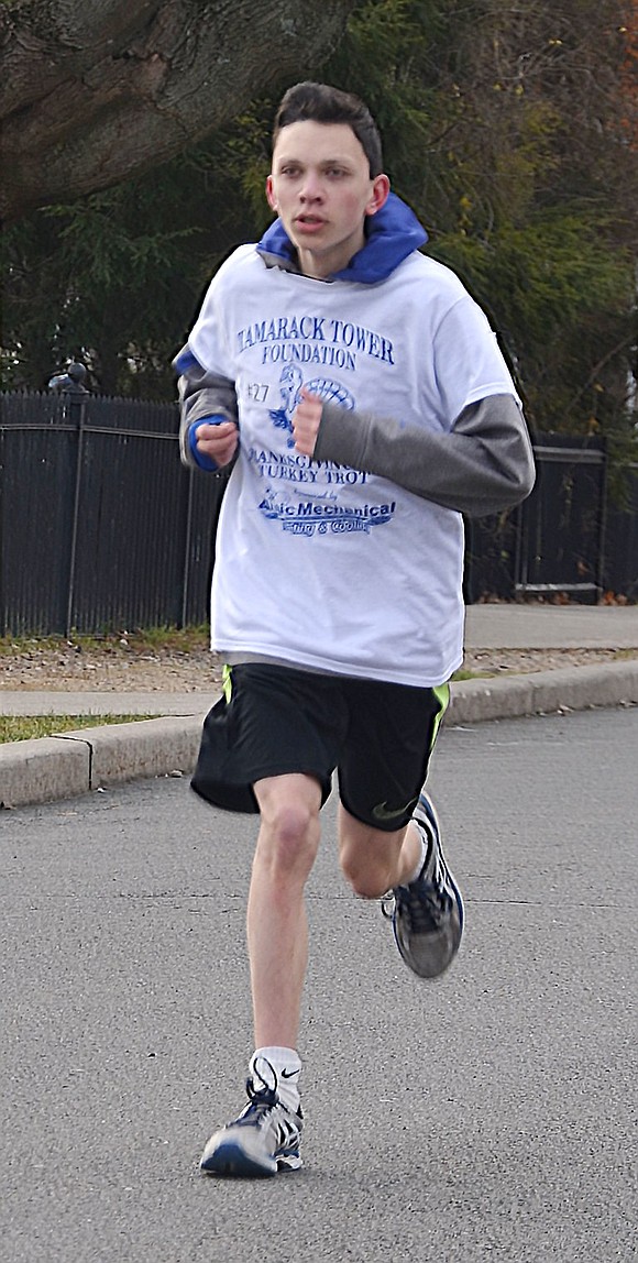 <p class="Picture">Port Chester High School junior and track and field team member Michael Sposato sports a Tamarack Tower Foundation T-shirt.</p>