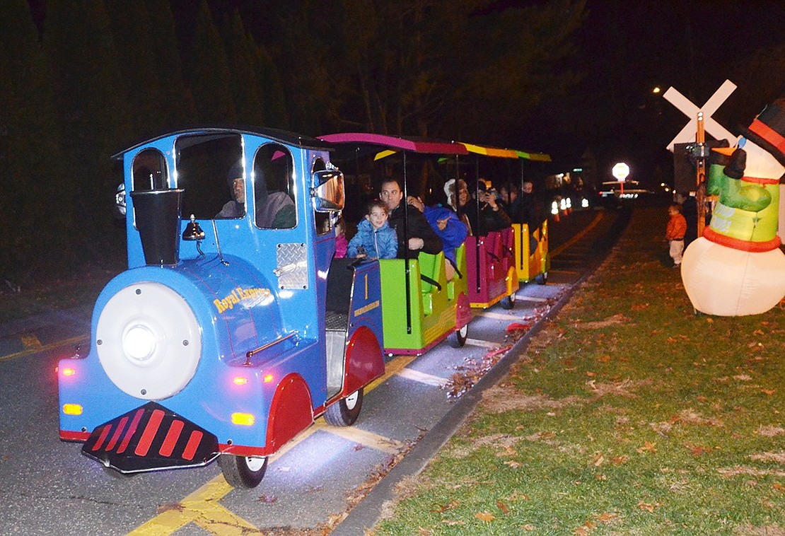 <p class="Picture">The line for the Royal Express train ride was as long as the basketball court. Kids couldn&rsquo;t wait to go on the slow trek around the holiday-themed park.&nbsp;</p>