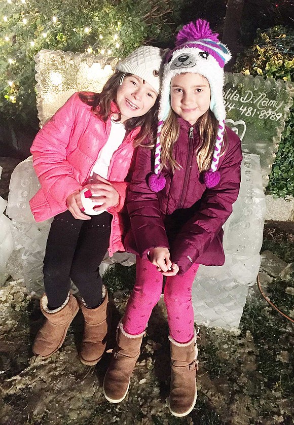 <p class="Picture">Rye Brook fourth graders Meghan McEvoy (left) and Addison Gabriel sit on Don Harrison&rsquo;s completed ice bench.</p> <p class="Right">Courtesy of Michael McEvoy</p>
