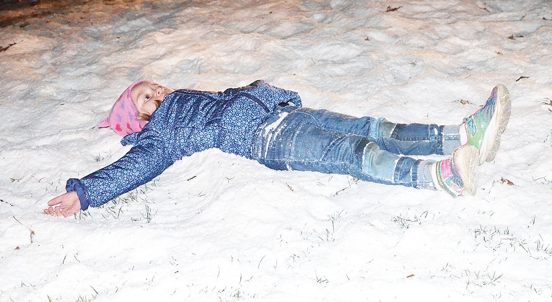<p class="Picture">Audrey Pe&ntilde;a of Stamford, Conn., attempts to make a snow angel in the fake snow. Her grandmother is from Rye Brook, which is how she knew about the event.&nbsp;</p>