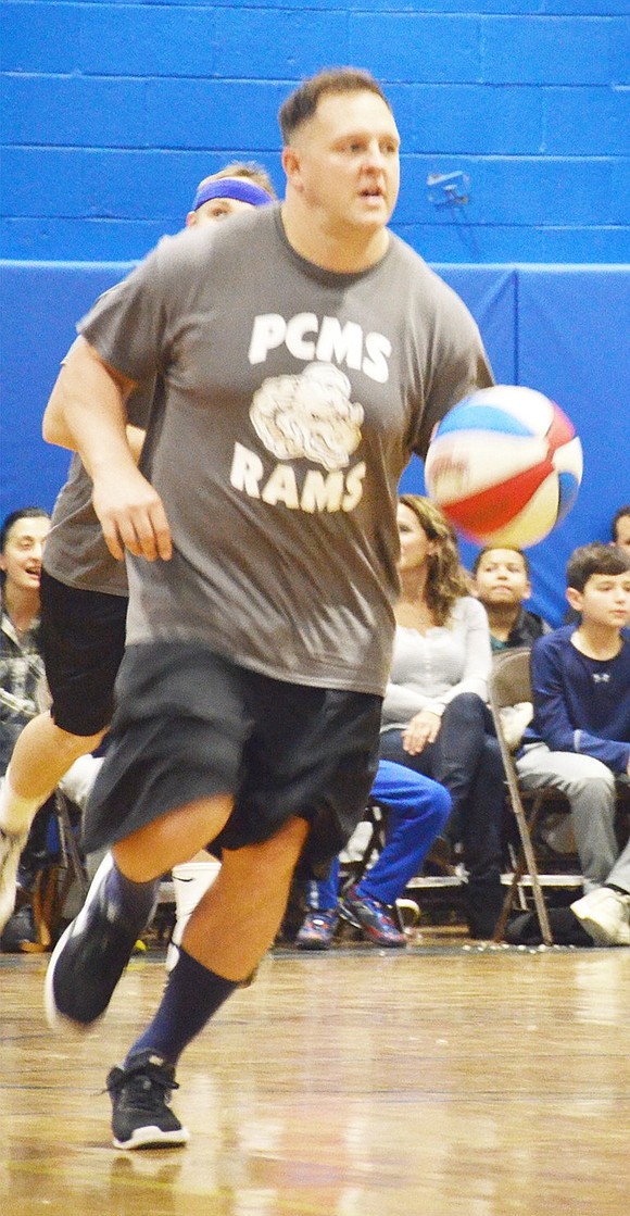 <p class="Picture">Port Chester 8<sup>th</sup> grade Social Studies teacher and Sawpit Academy Leader Frank Carlson drives the ball to the home team&rsquo;s basket.&nbsp;</p>