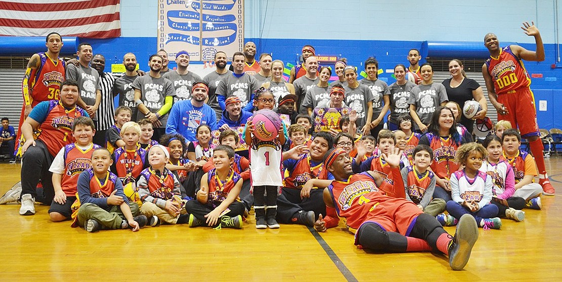 <span style="font-family: Arial;">All of the Wiz-Kids, youthful fans of the Wizards, and the teams pose for a group picture.&nbsp;</span>