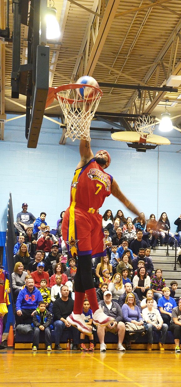 <p class="Picture">Swoop team member Sky Walker, No. 7, goes in for a slam dunk.&nbsp;</p>