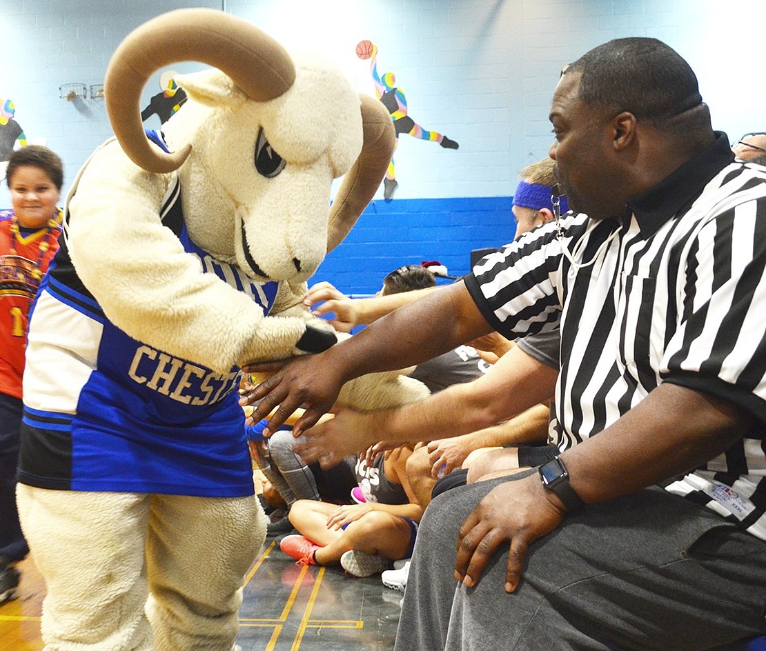 <p class="Picture">The Port Chester Ram gives high fives to the home team.&nbsp;</p>