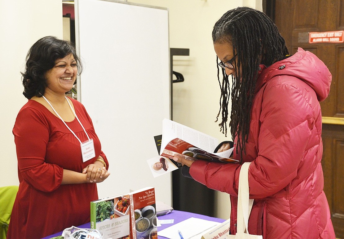 <p class="Picture">Tracey Jackson of Greenburgh is very interested in Valhalla author Rinku Bhattachary&rsquo;s book &ldquo;Spices and Seasons: Simple, Sustainable Indian Flavors.&rdquo;&nbsp;</p>