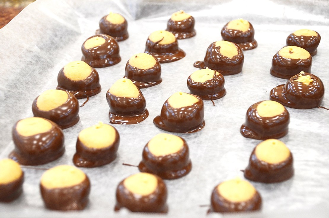 <p class="Picture">Buckeyes are peanut butter cookies dipped in melted chocolate and left to harden.&nbsp;</p>