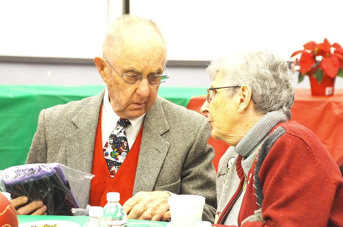 <p class="Picture">Festively dressed Sal and Rose Ann Sabia share a moment.</p>