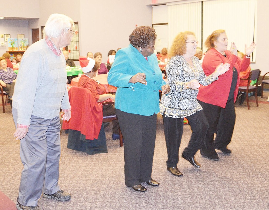 <p class="Picture">From left, Anthony Caracciola, Martha Bell, Kathy Guigliano and Susan Sabato do the Electric Slide to music spun by a DJ.</p>