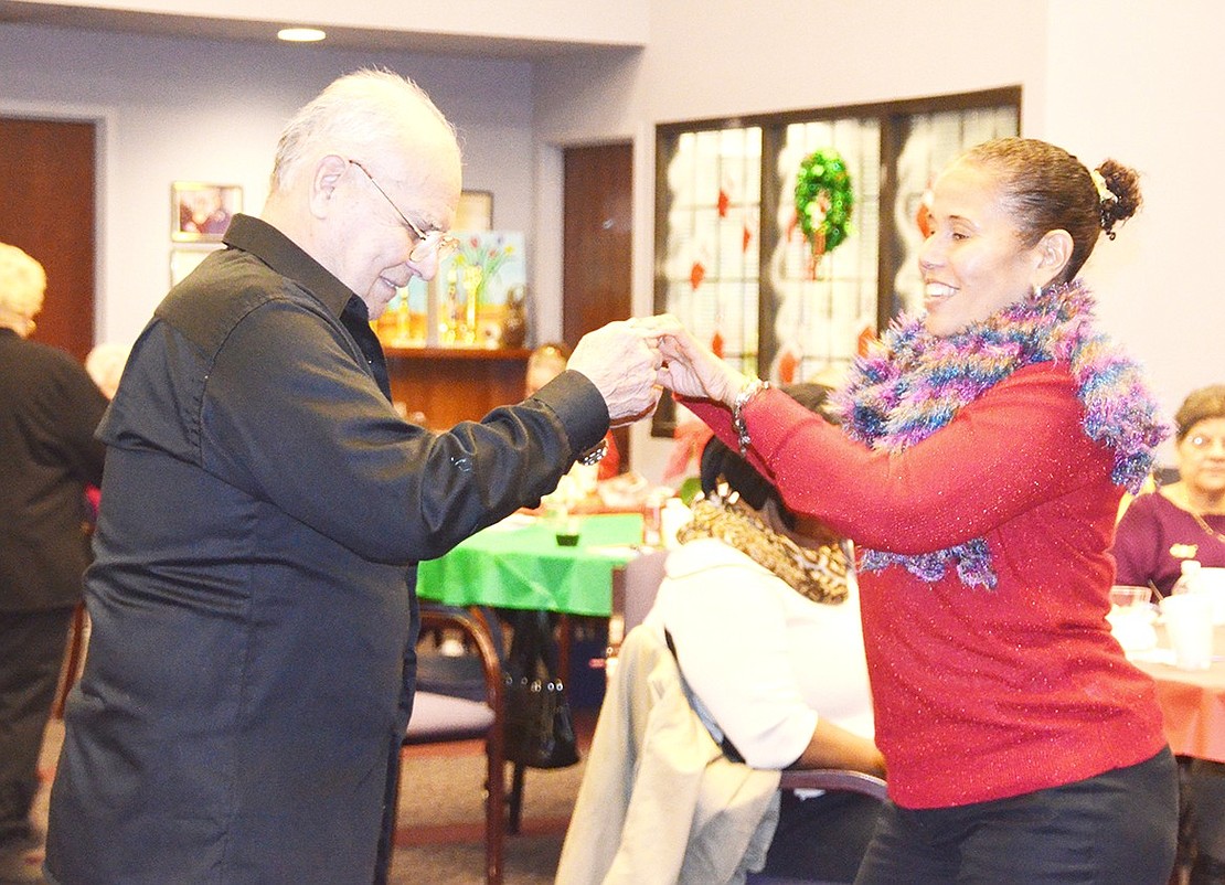 <p class="Picture">Victor Loayza and Claribel Paulino make great dance partners at the Port Chester Senior Center Christmas party on Saturday, Dec. 17. Photo story by Jananne Abel.&nbsp;</p>