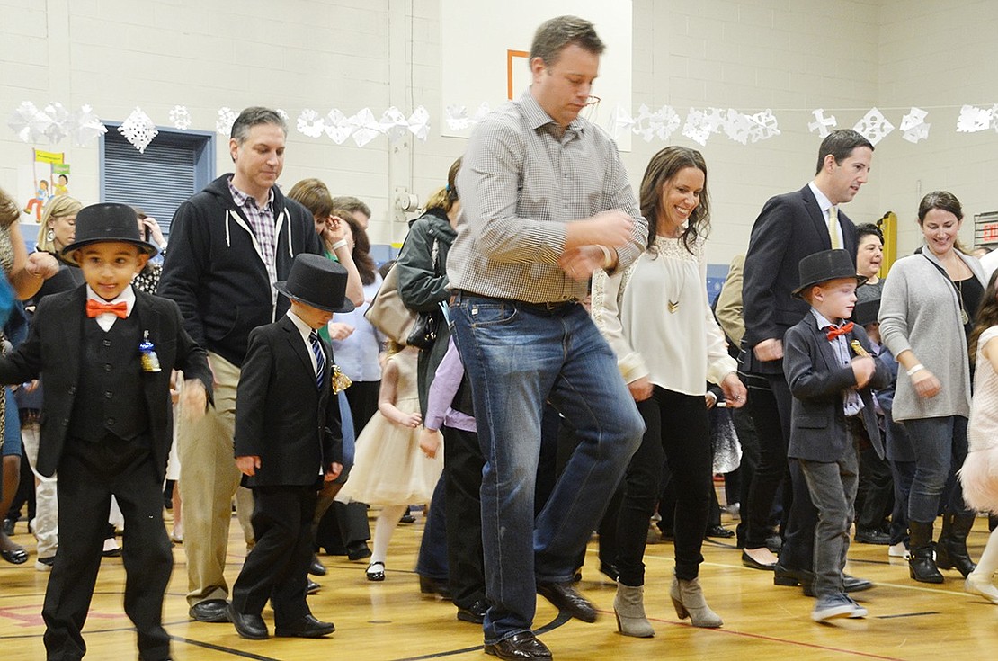 <p class="Picture">Parents join their kids on the dance floor to prove who has the better moves during the &ldquo;Cha Cha Slide&rdquo; by DJ Casper. &nbsp;</p>