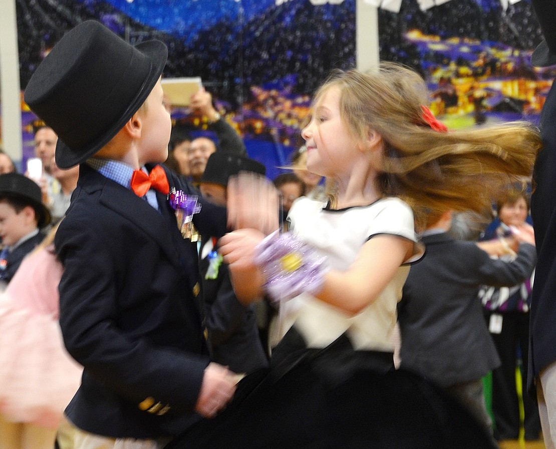 <p class="Picture">A blur of motion: John Halliday twirls his dance partner Julia Slotnick.</p>