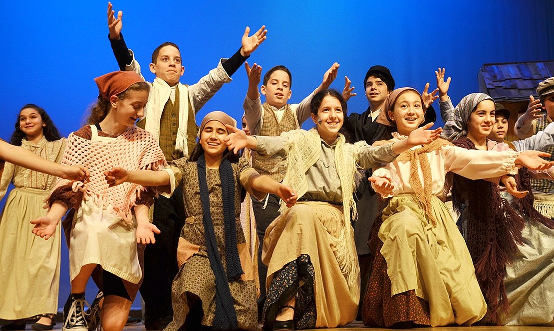 <p class="Picture">The cast celebrates after their final song &ldquo;Anatevka.&rdquo;</p>