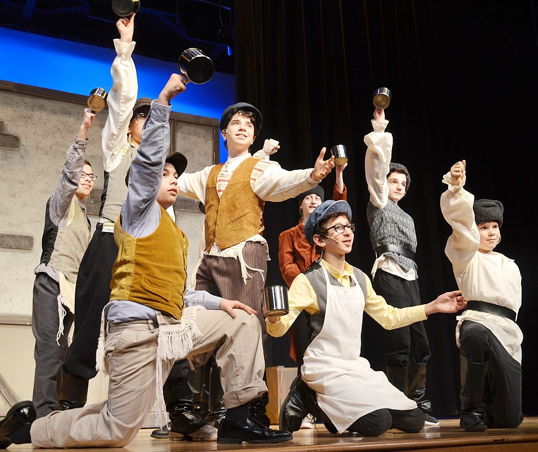 <p class="Picture">The bar patrons celebrate after Tevye, played by Zach Berger, promises his eldest daughter to the village butcher, Lazar Wolf, played by Noah Levine. Blind Brook Middle School presents &ldquo;Fiddler on the Roof, Jr.&rdquo; on Friday, Feb. 10 at 7 p.m. and Saturday, Feb. 11 at 12 p.m. and 2:30 p.m. Tickets are $12 and can be purchased up to one hour prior to the show in the Blind Brook Middle/High School lobby, right outside the auditorium doors. The show has two casts that split the performances. Photo story by Casey Watts</p>