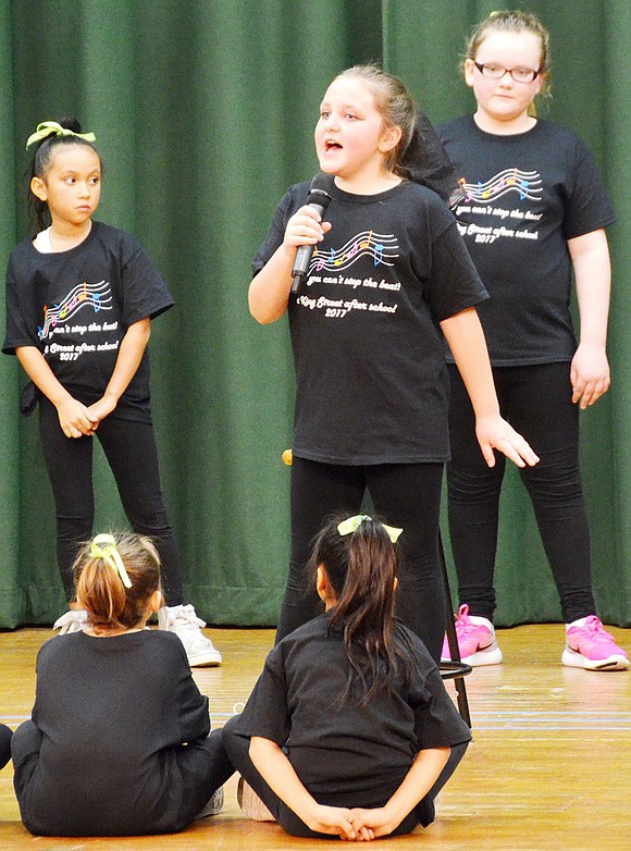 <p class="Picture">Soloist Rachael Stover channels her inner Deborah Kerr as she belts out &ldquo;Getting to Know You,&rdquo; a song from the musical &ldquo;The King and I.&rdquo; Performing with her are students from the third and fourth grade.&nbsp;<span style="font-family: Arial;">Third, fourth and fifth graders in the after school program at King Street School performed &ldquo;You Can&rsquo;t Stop the Beat,&rdquo; a show full of singing and dancing, for their family members on Friday, Feb. 10, thanks to the Port Chester Council for the Arts. Photo story by Casey Watts</span></p>