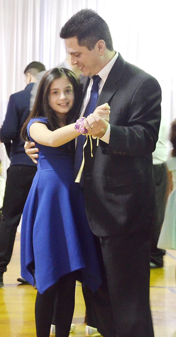 <p class="Picture">Robert Sachs looks lovingly at his daughter Jessica, 11.&nbsp;</p>