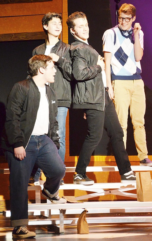 <p class="Picture">It&rsquo;s all about acting too cool for school. Here, (left) Doody, Sonny, Danny Zuko, and Eugene Florczy (right) talk during lunch. They are played by Adam Fleishaker, Justin Levine, Sammy Landino and Ryan Vogt, respectively.&nbsp;</p>