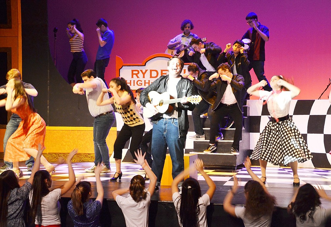 <p class="Picture">Doody, played by senior Adam Fleishaker, shows off his new guitar while singing &ldquo;Those Magic Changes.&rdquo; Blind Brook High School is performing &ldquo;Grease&rdquo; on Friday, March 10 at 7:30 p.m. and Saturday, March 11 at 2 p.m. and 7:30 p.m. Tickets are $12 for kids under 12 and seniors and $15 for adults.</p>