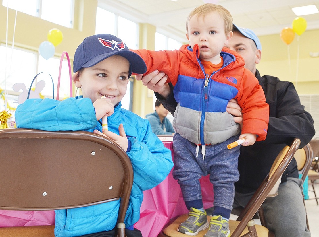 <p class="Picture">It was Rye Brook resident Colin Nates&rsquo;s first time meeting the Easter Bunny. The 1-year-old and his 6-year-old brother Ryan pose together as they wait for the white rabbit to make an appearance. </p> <p class="Right">Casey Watts|Westmore News</p>