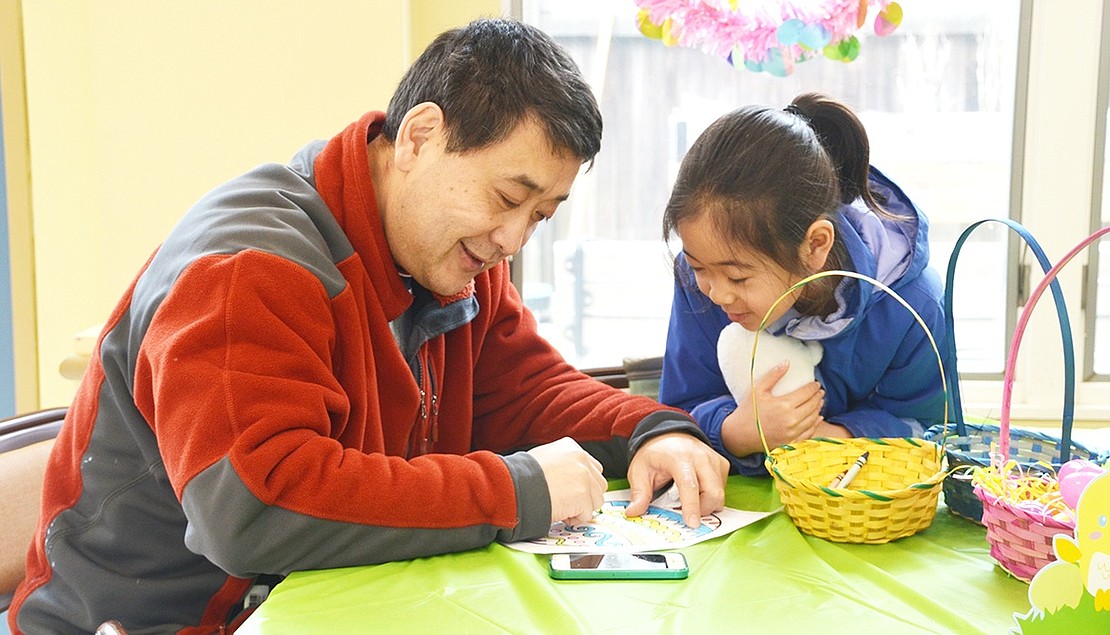 <p class="Picture">Rye Brook father Lei Bo shows his 3-year-old daughter Eva how to color a beautiful Easter egg. </p> <p class="Right">Casey Watts|Westmore News</p>