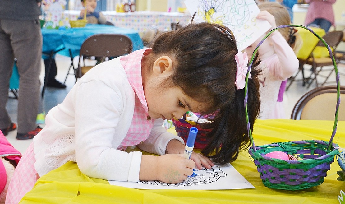 <p class="Picture">Three-year-old Amelia Zuccarelli colors an Easter basket. The Avon Circle resident was more excited over the balloons at various tables than staying within the lines. </p> <p class="Right">Casey Watts|Westmore News</p>