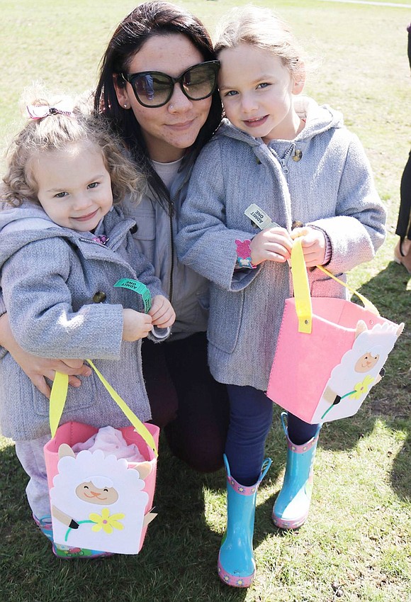 <p class="Picture"><span style="font-family: Arial;">Gabriella, 5, and Sophia Bonvino, 2, of Locust Avenue, wearing matching gray jackets and carrying matching Easter baskets, pose with their mother Sara while waiting in the long line to see the Easter Bunny.</span></p> <span style="font-family: Arial;"> Joseph DeCarlo|Westmore News</span>