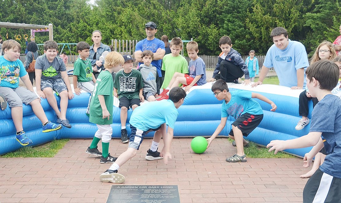 The boys play a version of soccer that allows hands. 