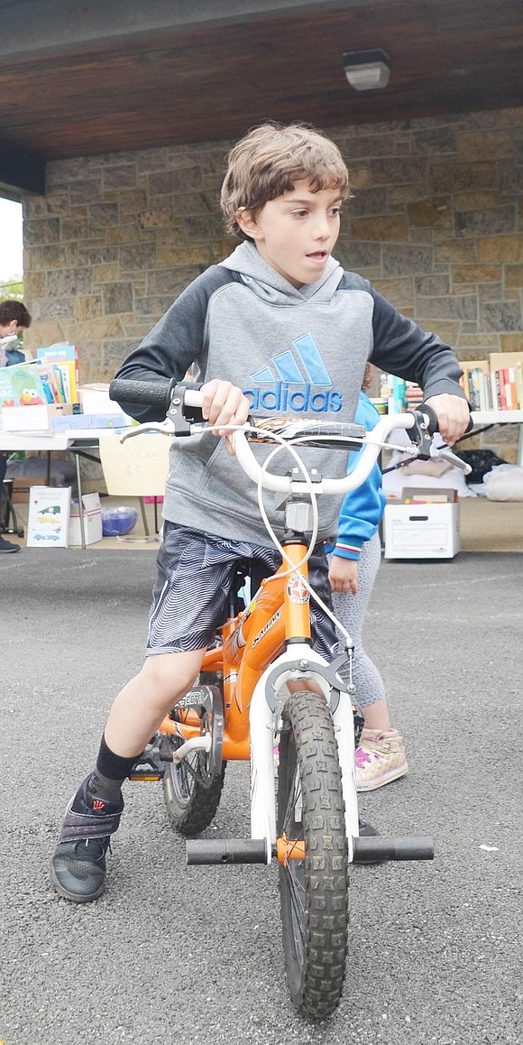 Second grader Michael Dinverno saw an orange bike for sale and immediately ran towards it. The 8-year-old was riding around excitedly yelling “Yes, this is my bike!” while riding it in front of the elementary school. His parents later purchased it for him. 