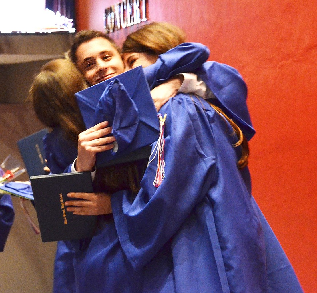 Group hug! Graduates Meredith Berger, Ariel Bittelman and Daniel Copland embrace with enthusiasm following the Blind Brook High School commencement on Thursday, June 22 in SUNY Purchase’s Performing Arts Center. Casey Watts|Westmore News 